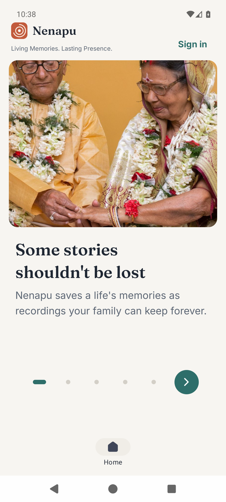The Nenapu welcome screen — an elderly couple garlanded at their celebration, one tap to begin